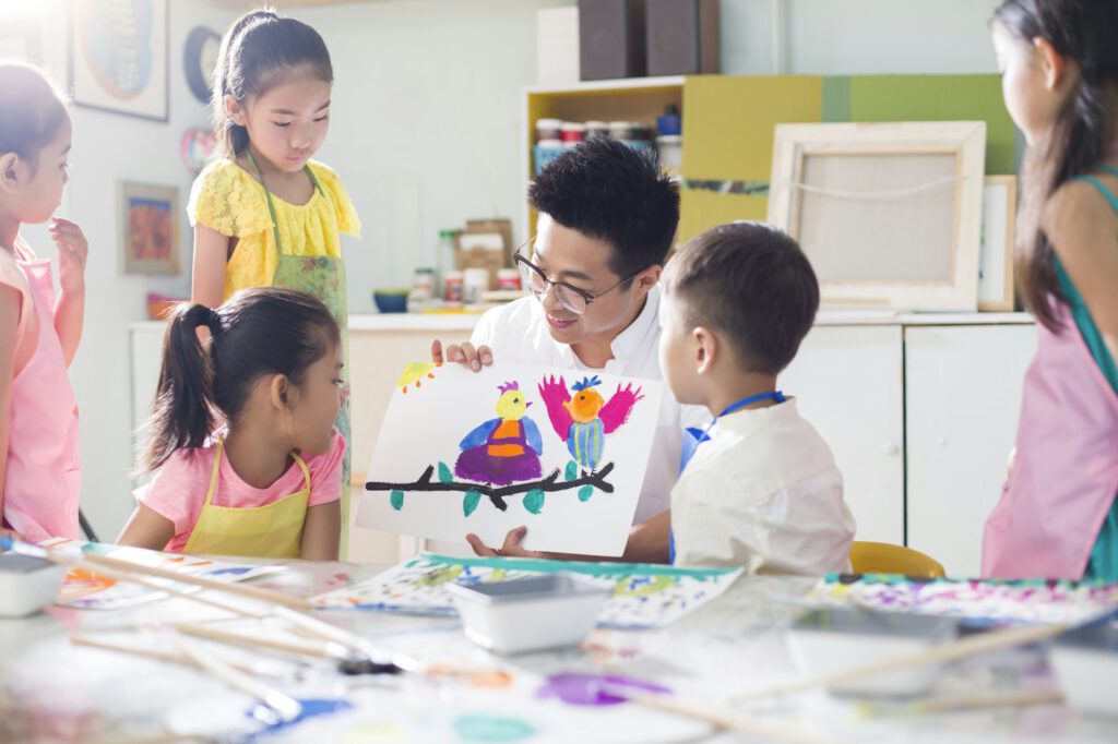 Little children in art class with teacher